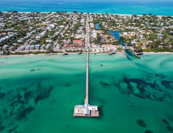An aerial view of the Anna Maria City Pier and its surrounding waters