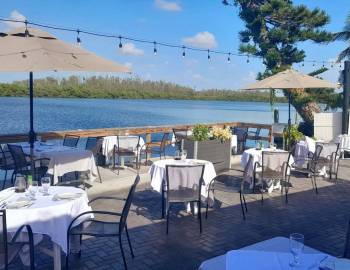 Outdoor dining area overlooking the water