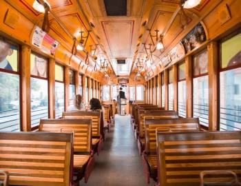 Wooden seats in the interior of a historic-style Florida trolley car