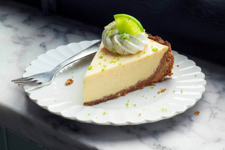 A slice of key lime pie on a plate