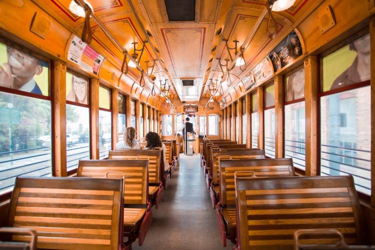Wooden seats in the interior of a historic-style Florida trolley car