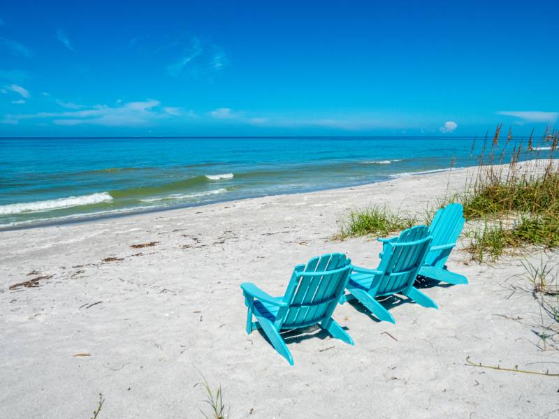 Chairs on a beach facing the ocean