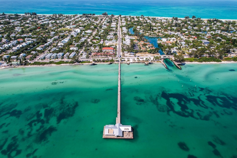 An aerial view of the Anna Maria City Pier and its surrounding waters