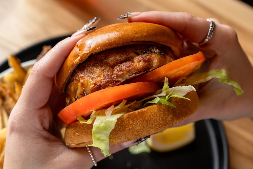 A closeup of a fish cake sandwich
