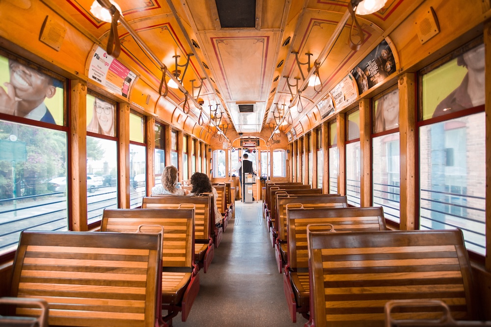Wooden seats in the interior of a historic-style Florida trolley car