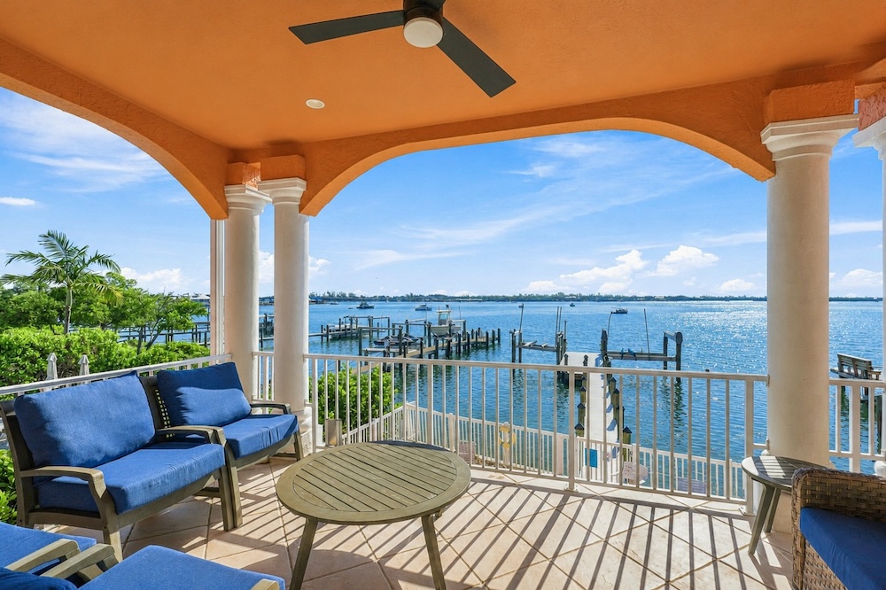 Vacation rental condo balcony overlooking a harbor